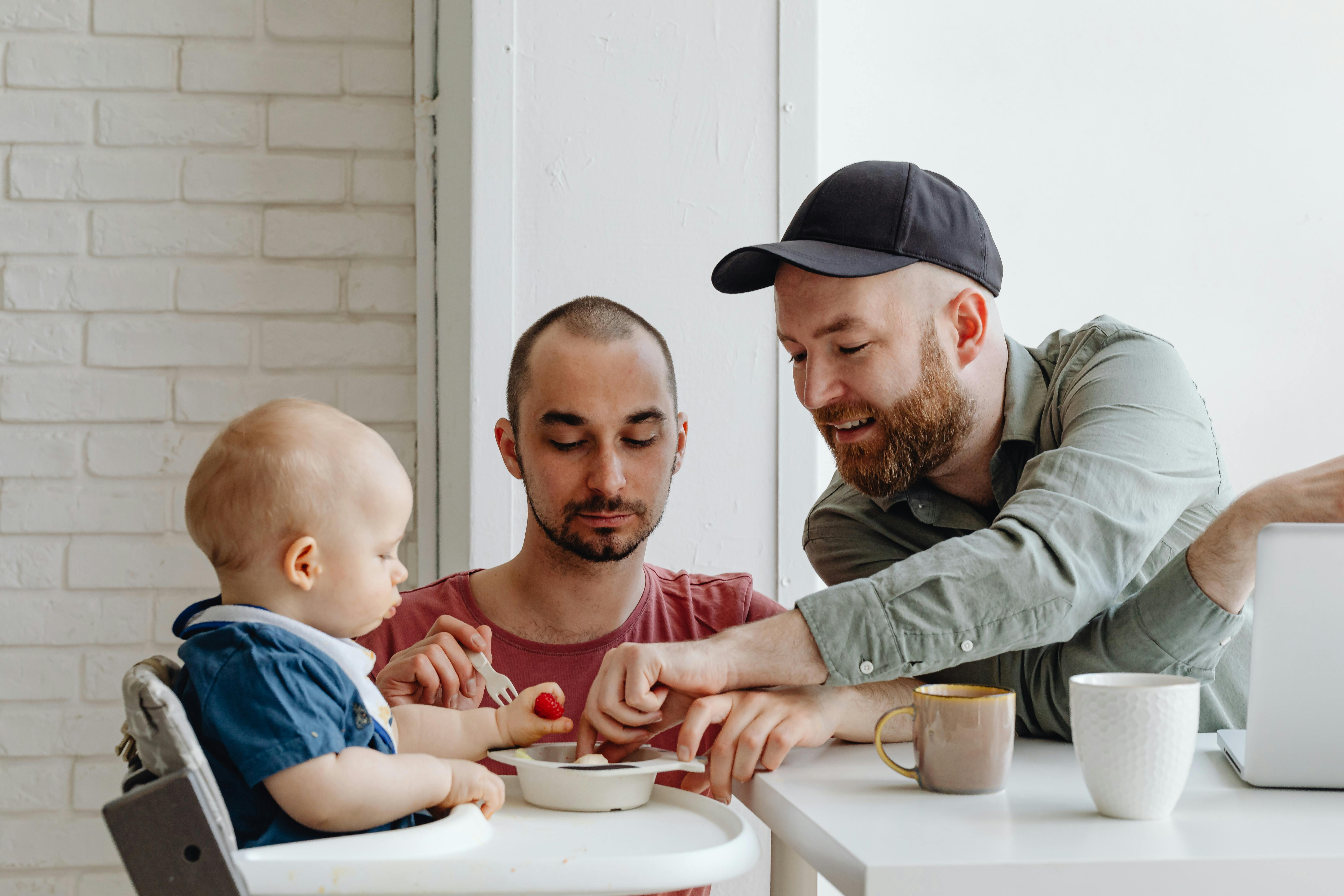 interracial couple feeding baby