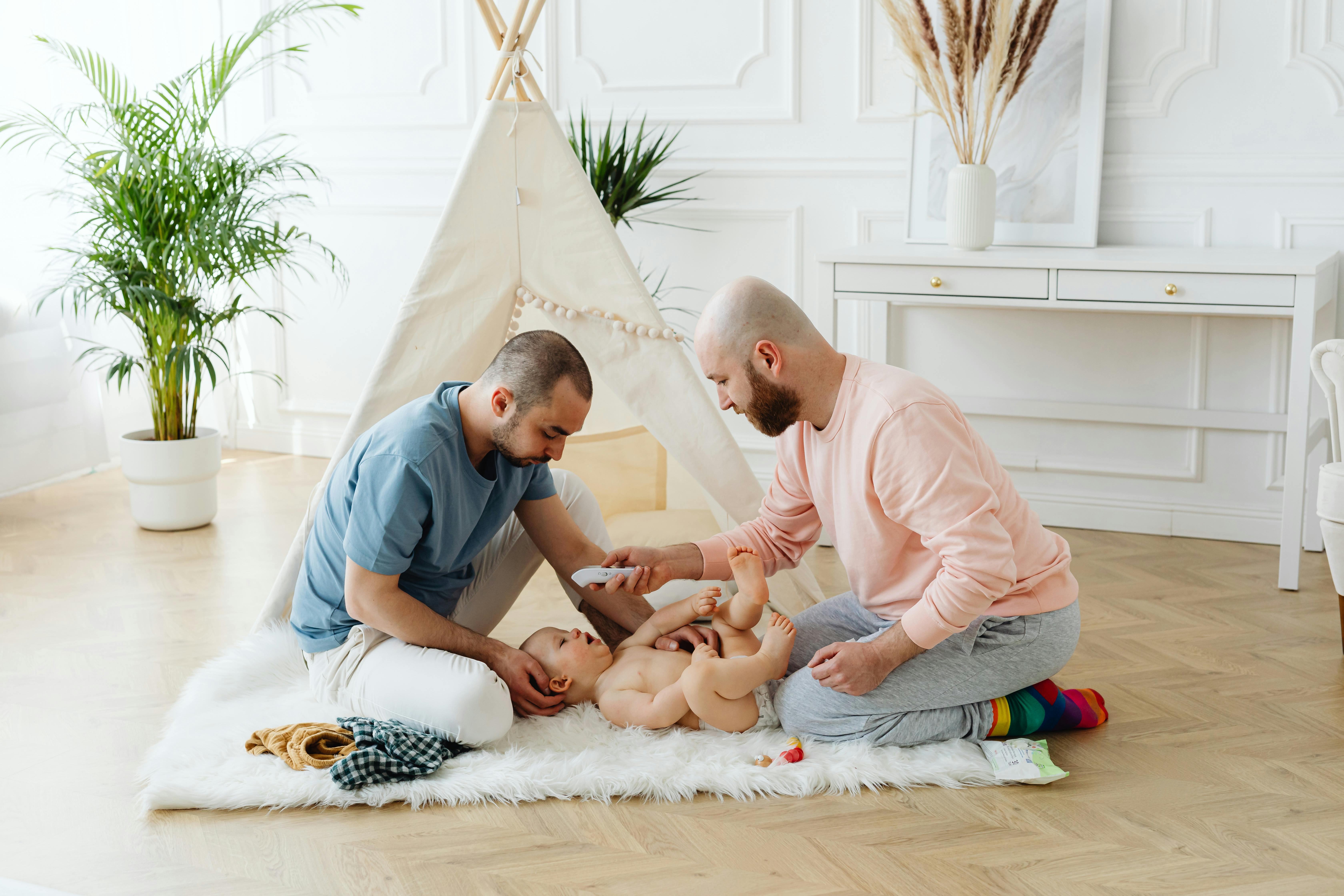 concerned parents checking their babys temperature