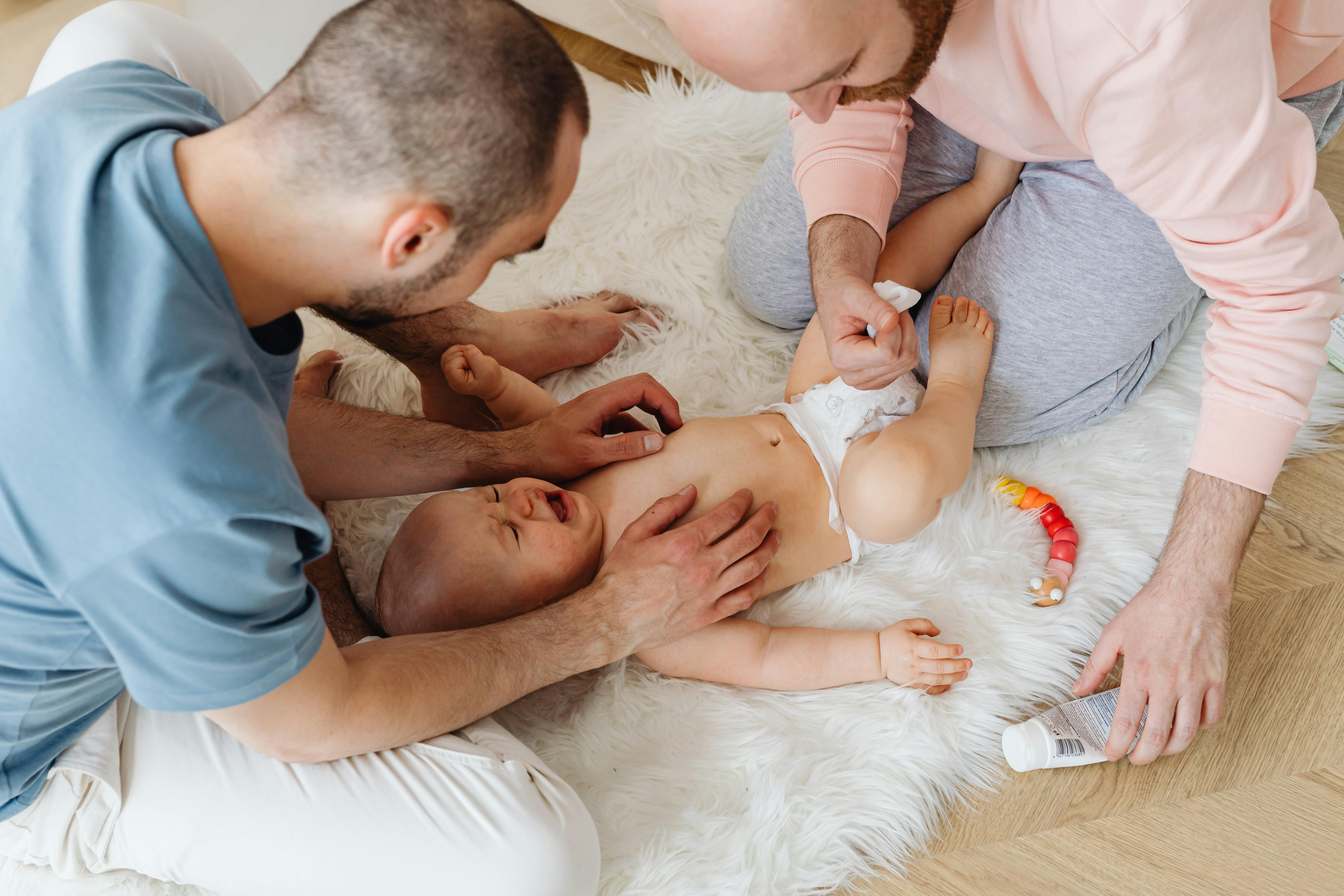 parents calming their crying baby