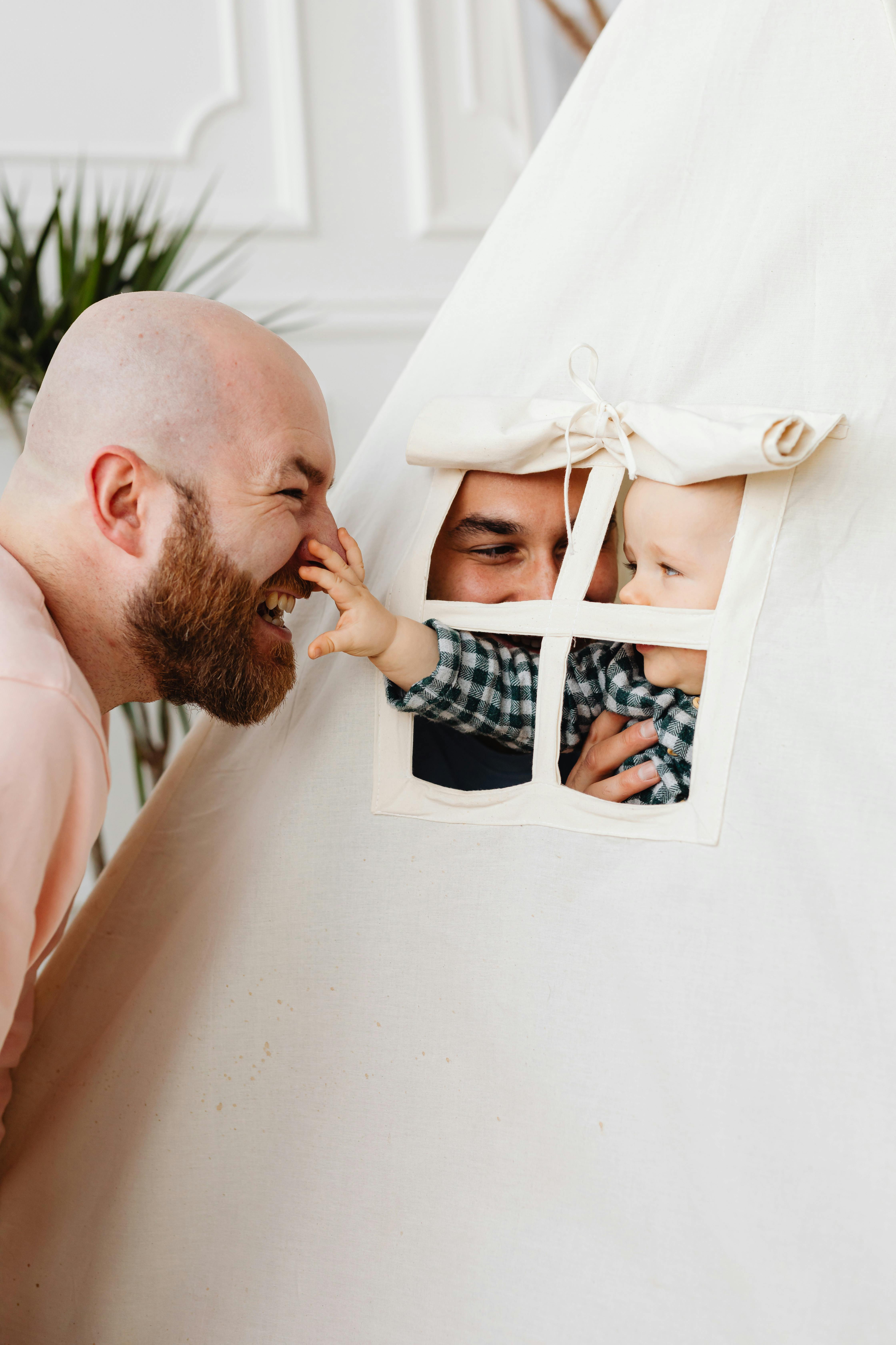 parents playing with their son