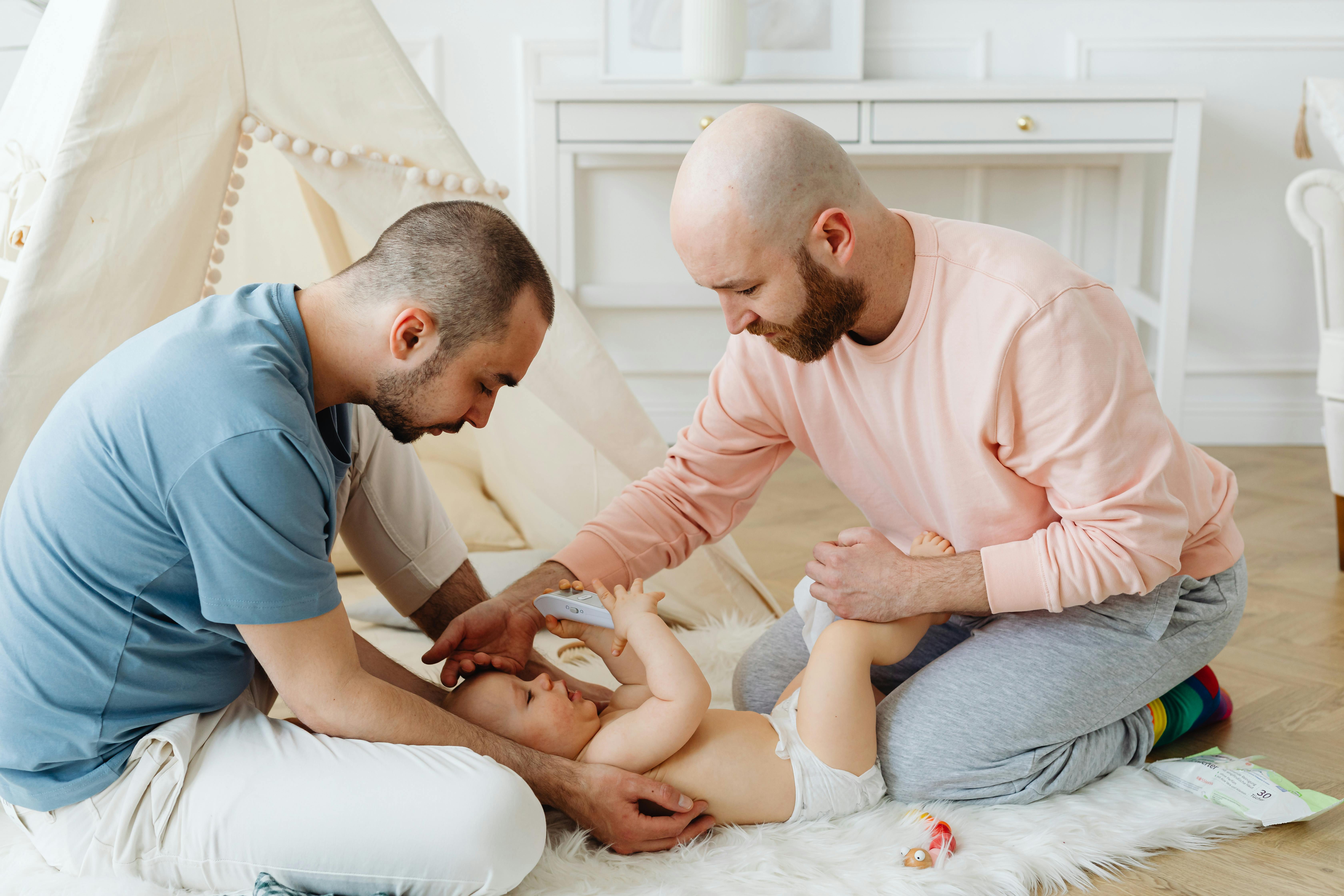 parents taking care of their baby