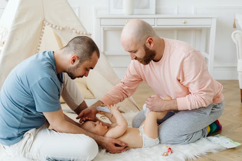 Parents Taking Care of Their Baby