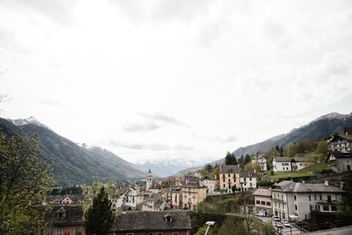 Free Scenic view of a quaint Italian village nestled in the mountains during spring. Stock Photo