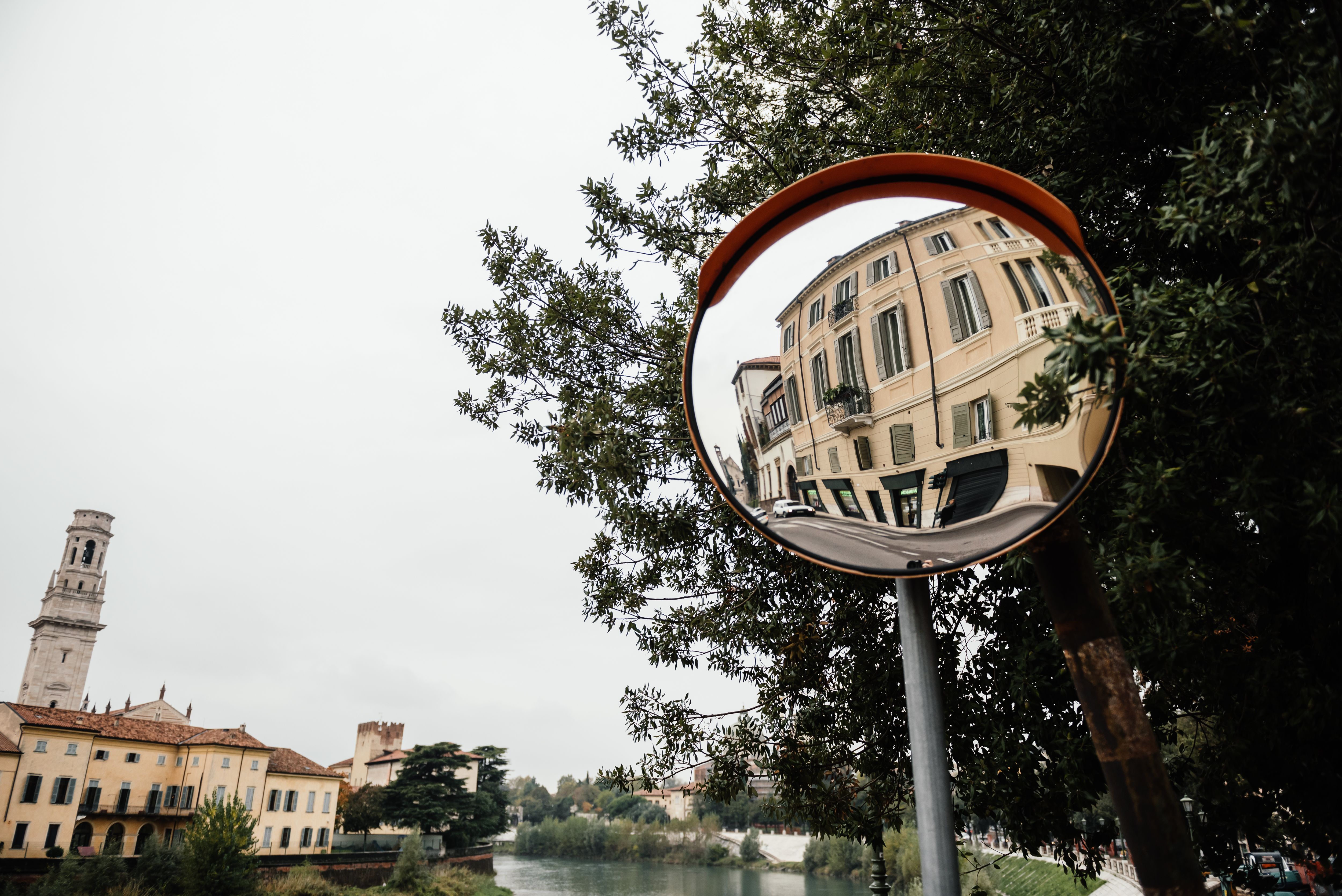 Reflection of Building in a Roadside Mirror · Free Stock Photo