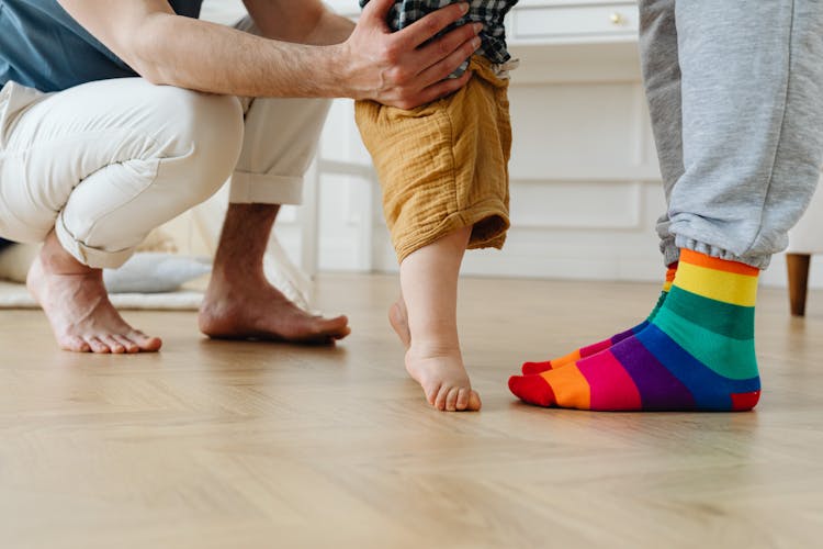 Man Supporting Toddler