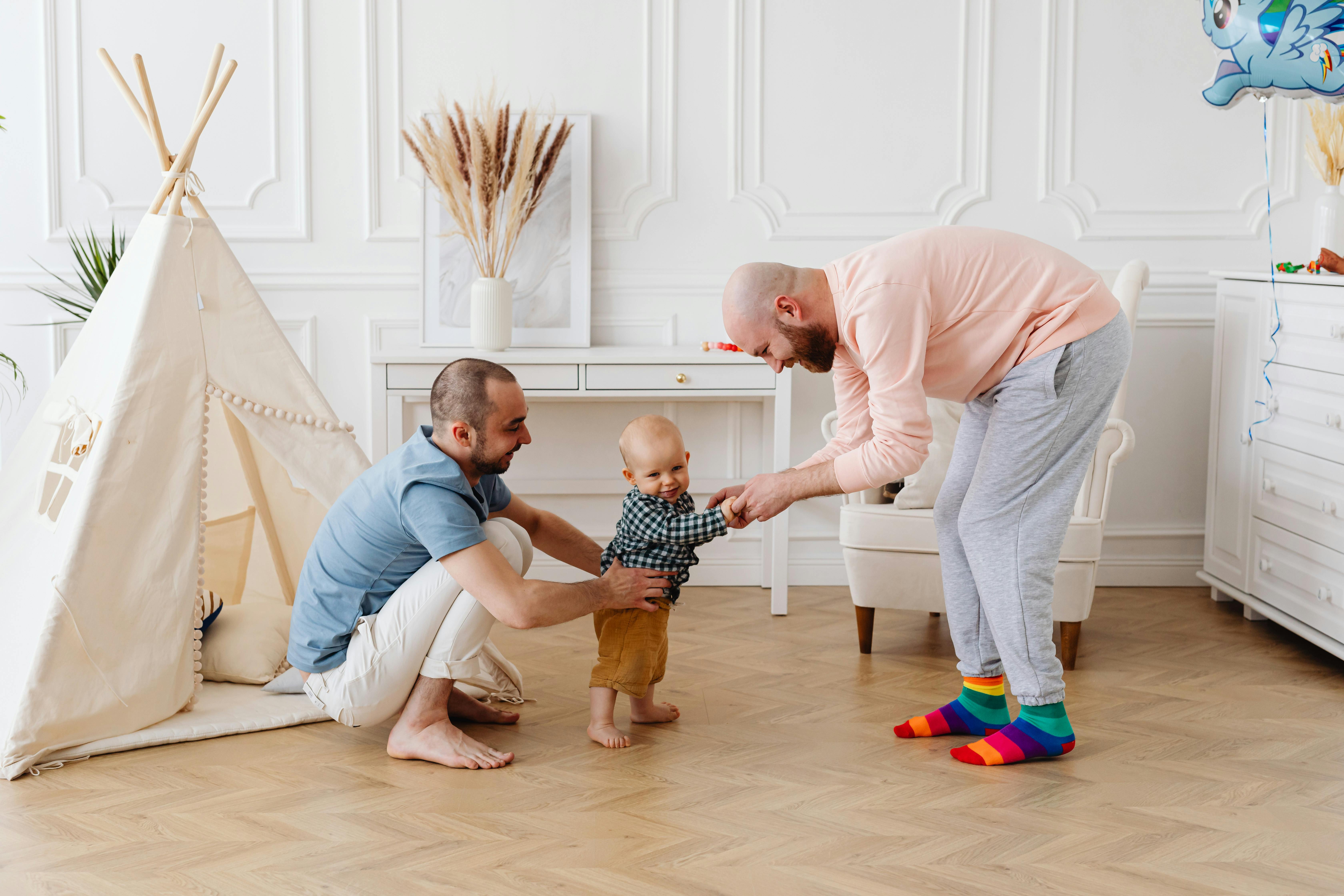 a same sex couple taking care of their son