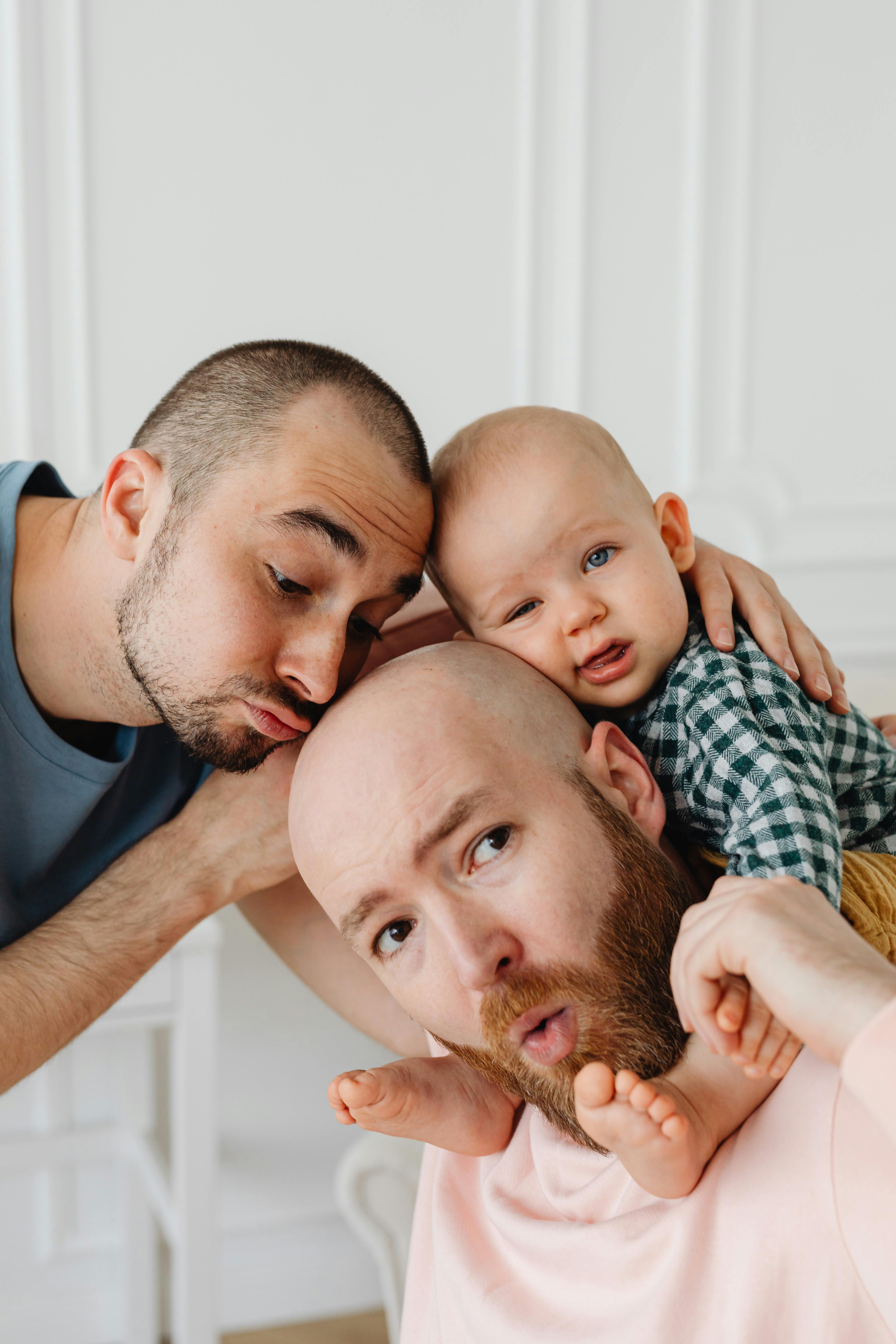 a cute baby boy with his same sex parents