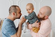 A Couple Carrying their Child
