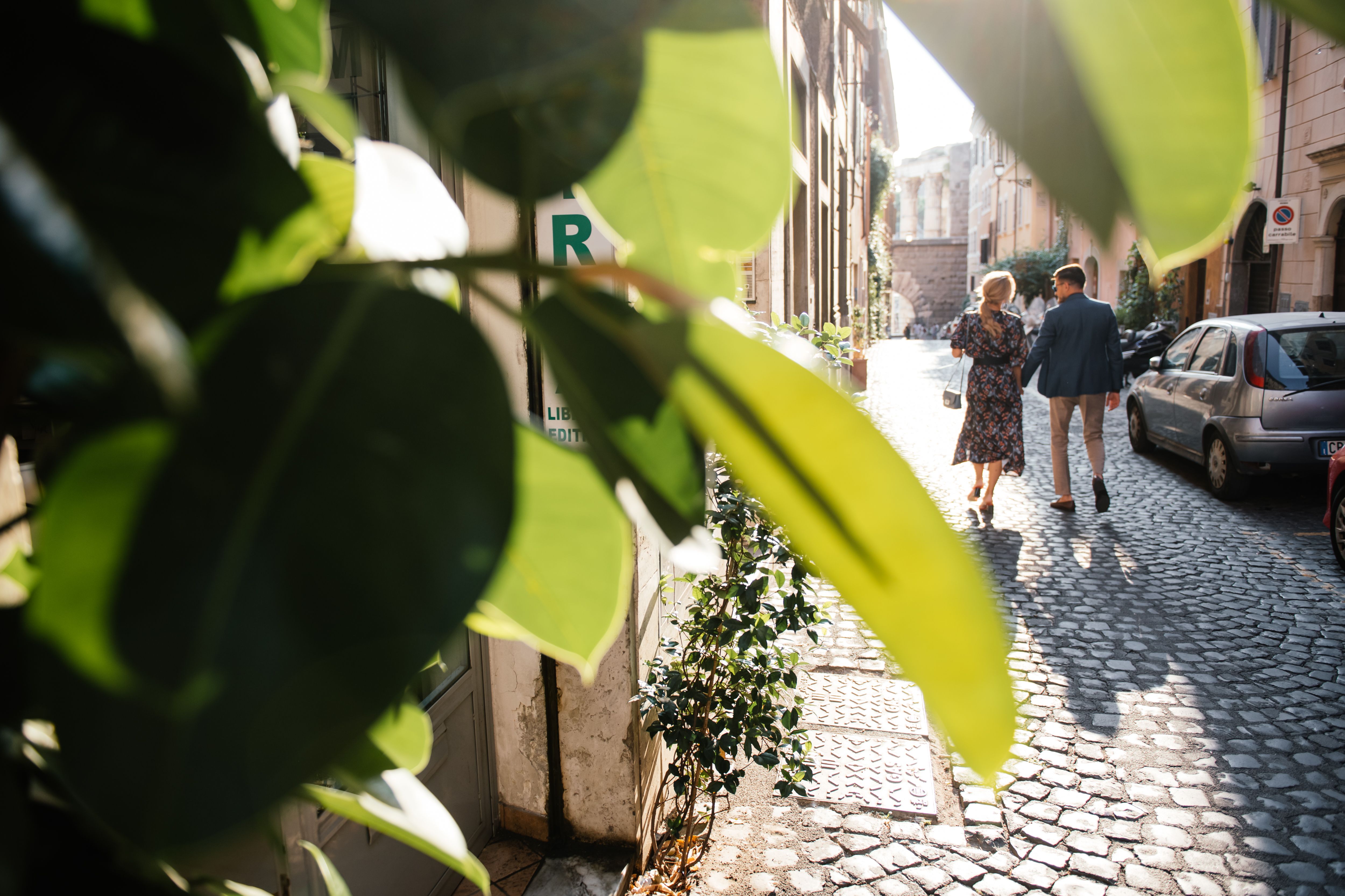 A Back View of a Couple Walking on the Street · Free Stock Photo