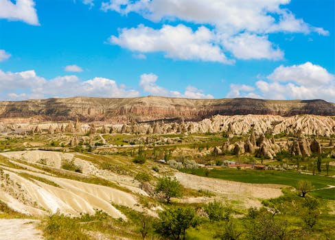 Explore the unique geological formations and vibrant landscape in Cappadocia, Turkey.