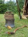 Brown Wooden Stick on Gray Metal Bucket