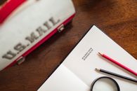White and Red Click Pen on White Paper
