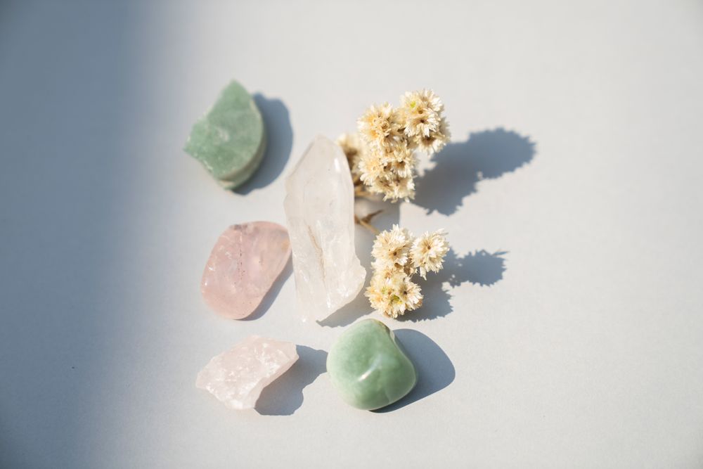Crystals and dried flowers arranged like an unboxing
