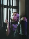 A Woman Sitting while Smoking Weed
