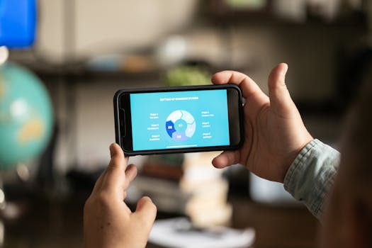 Close-up of hands holding a smartphone displaying a business chart indoors.