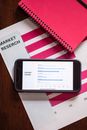 Black Samsung Galaxy Smartphone on White and Red Spiral Notebook