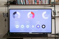 Black Flat Screen Tv Turned on Displaying Icons