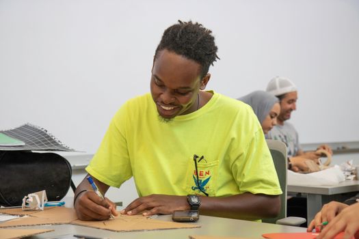 Students of diverse backgrounds enjoying a creative art class together.
