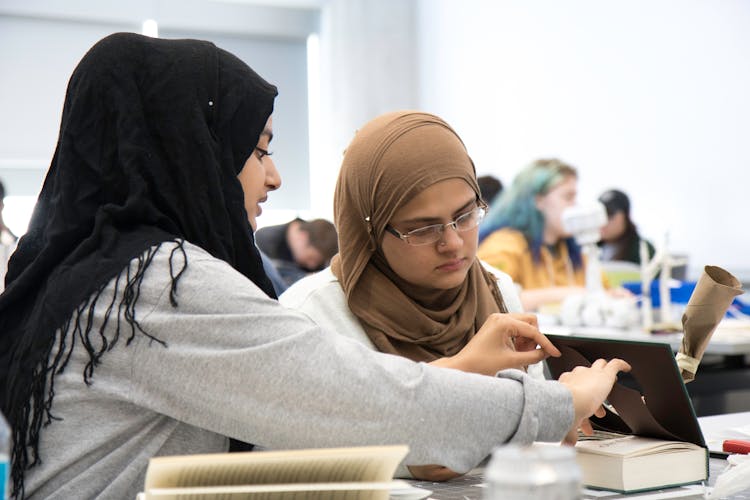 Women Wearing Headscarfs In A Classroom