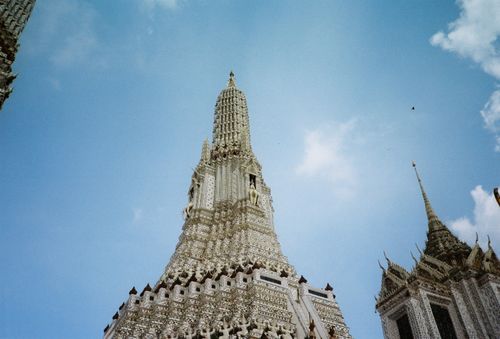 Free Low angle view of Wat Arun temple against a clear blue sky in Bangkok, Thailand. Stock Photo
