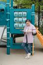 Female designer working against children slide