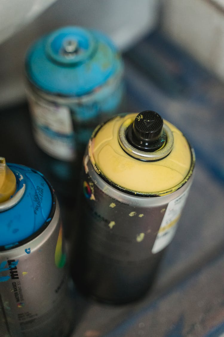 Close-up Of Spray Paint Cans 