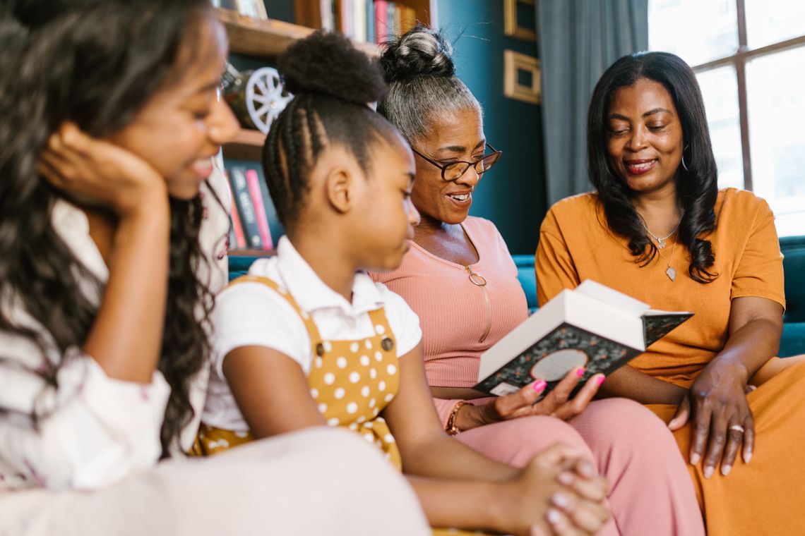 Family reading together in a calm home environment and supporting a young learner