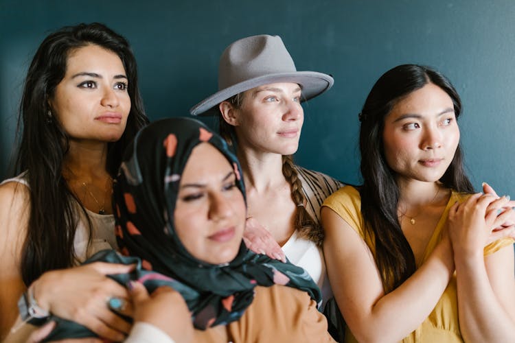 A Diverse Group Of Women Posing Together For A Picture 