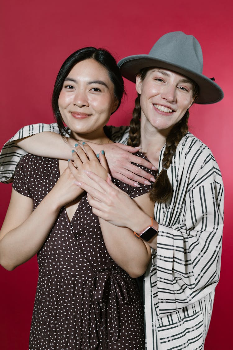 Smiling Women Embracing Each Other