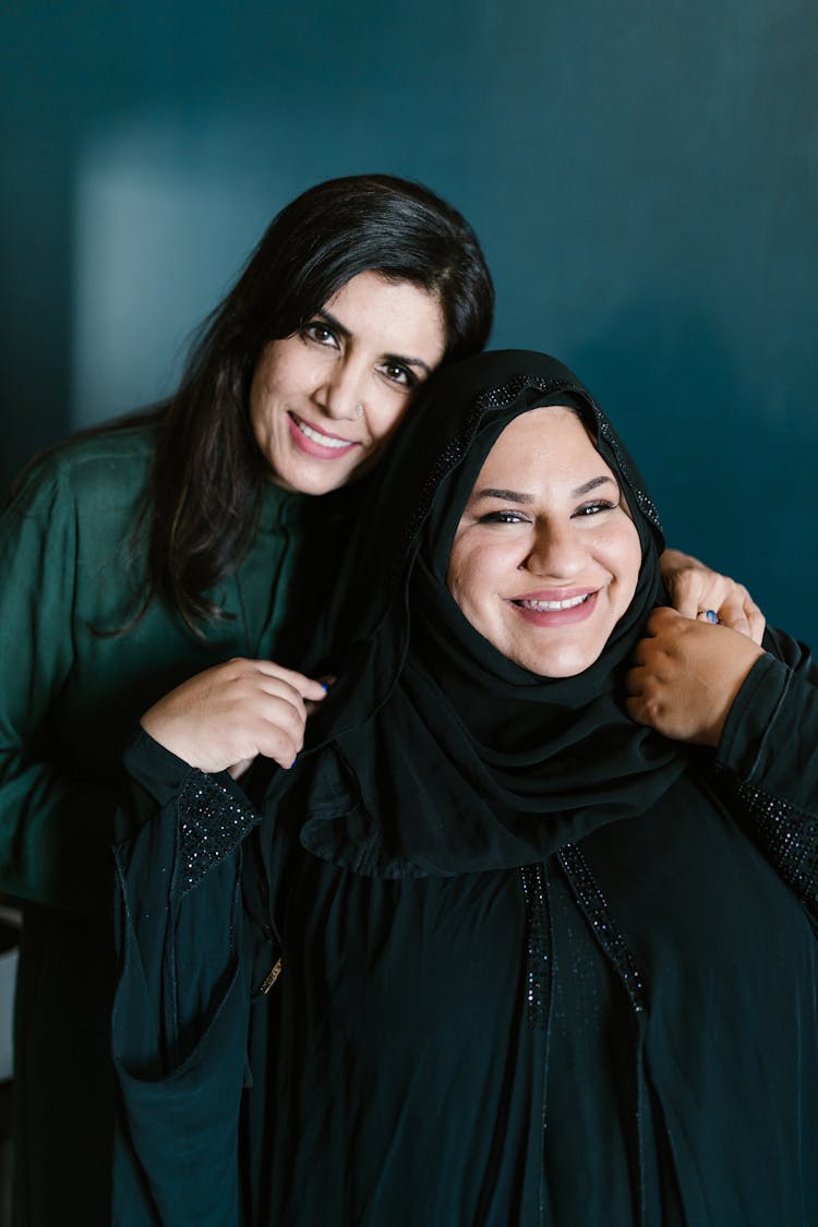 Smiling Women Embracing Each Other