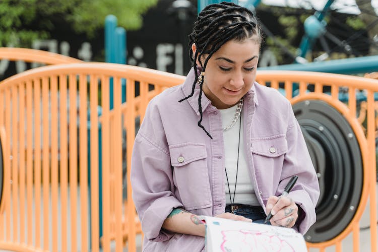 A Woman Writing In The Notebook