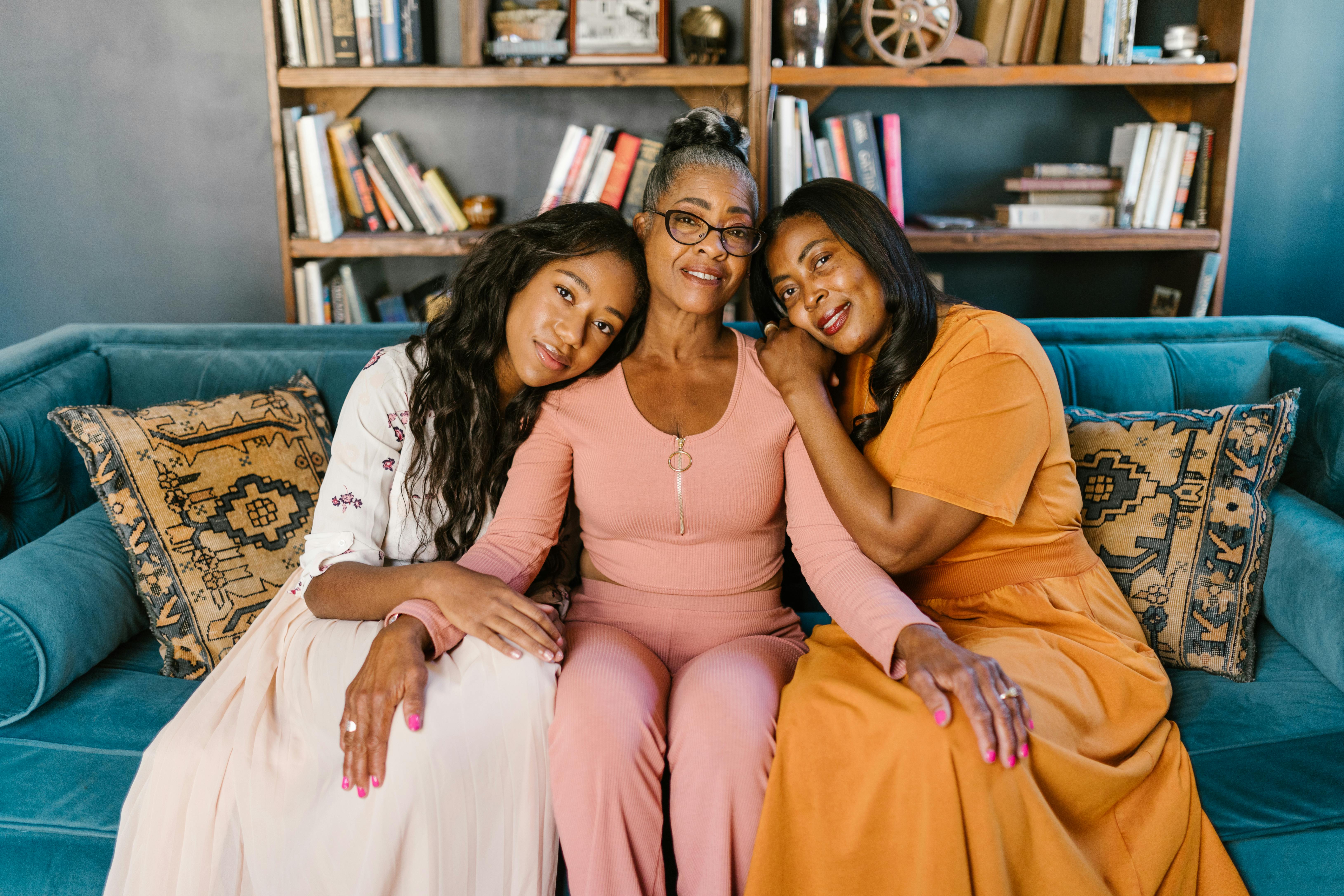 women leaning on the person in pink long sleeves