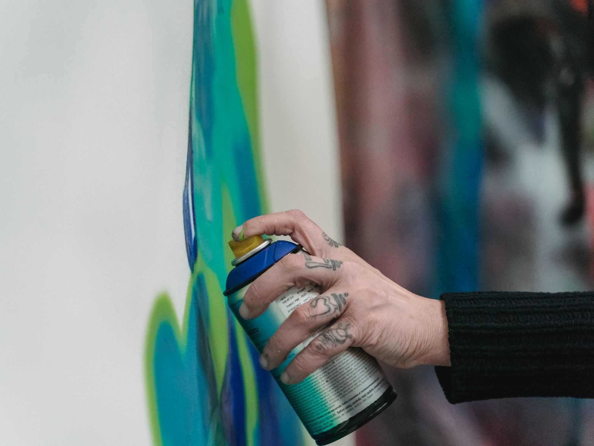 Painters & Decorators in Hook, London — professional decorator painting a wall with a roller