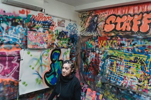 Woman Posing near Graffiti Wall