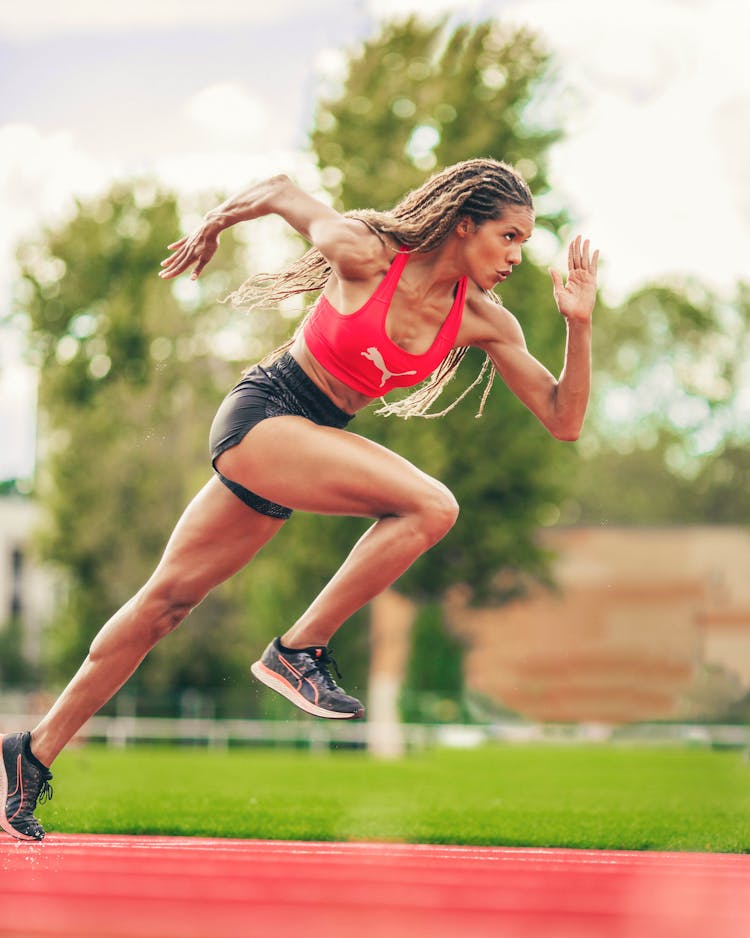 Woman In Red Sports Bra Running