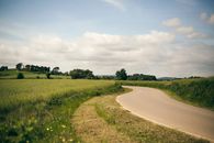 Green Grass Field Under White Clouds