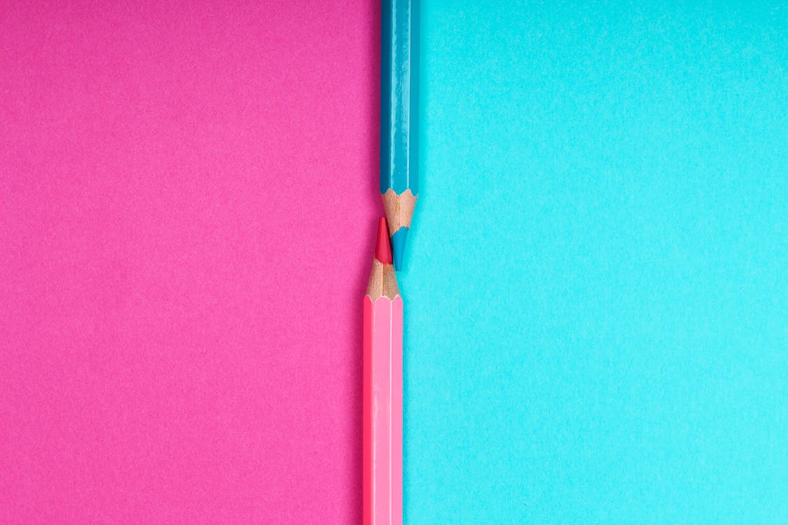 Close-Up Photograph of Blue and Pink Colored Pencils