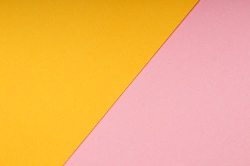 Close-Up Shot of a Pink Surface and Yellow Surface