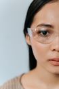 Close-Up Shot of a Woman Wearing Eyeglasses on White Background