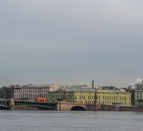 Free Scenic view of historical buildings and bridge over the Neva River in St. Petersburg, Russia. Stock Photo