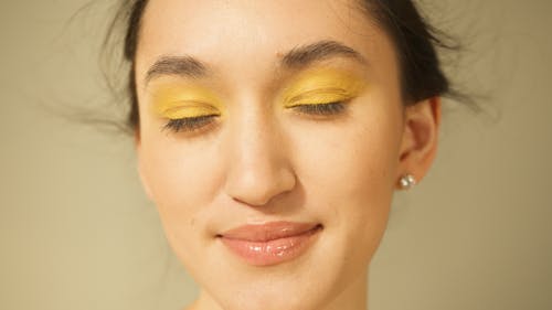A Woman With Yellow Eyeshadow Makeup