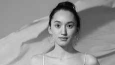 Grayscale Photo of a Woman Wearing Hoops Earrings