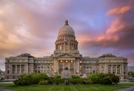 Exterior of famous Idaho State Capitol building located in America under colorful sky at sunrise