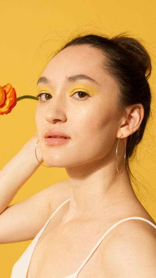 Close-Up Shot of a Model With Yellow Eye Shadow