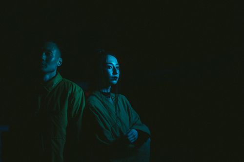 Free Dramatic portrait of a man and woman in traditional wear with blue lighting. Stock Photo