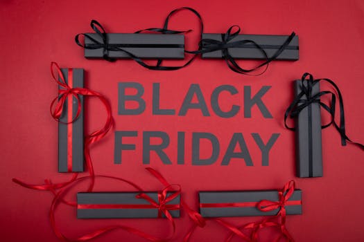 Black Friday gift boxes with ribbons on a red background, perfect for holiday promotions.
