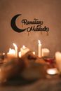 Lighted Candles and a Decorated Wall