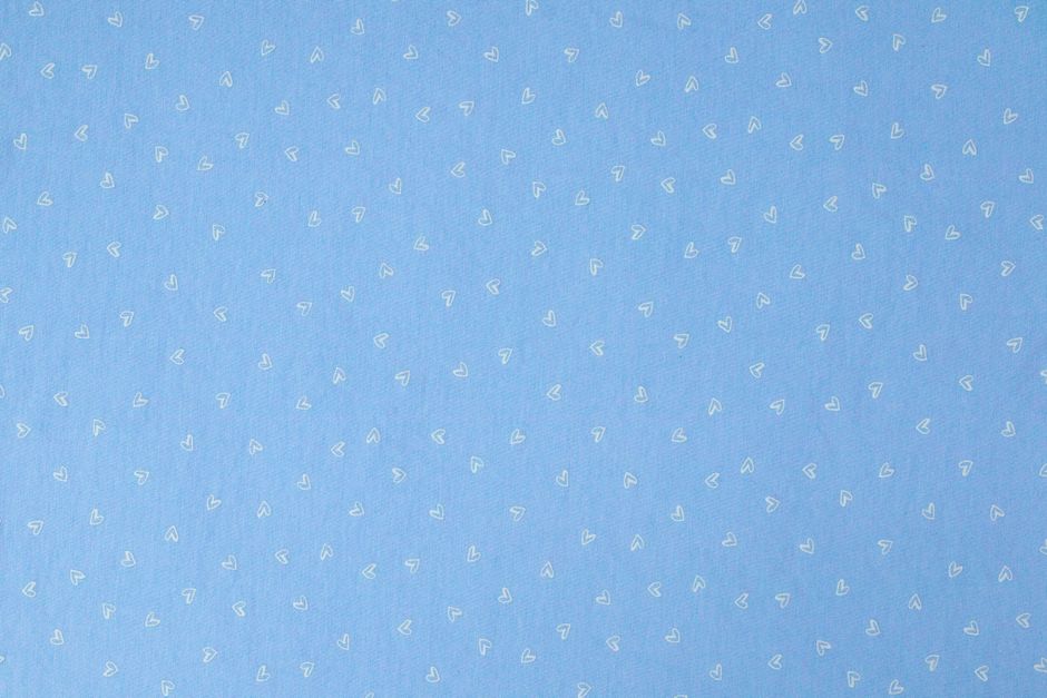 A light blue background with a delicate heart pattern ideal for designs and presentations.