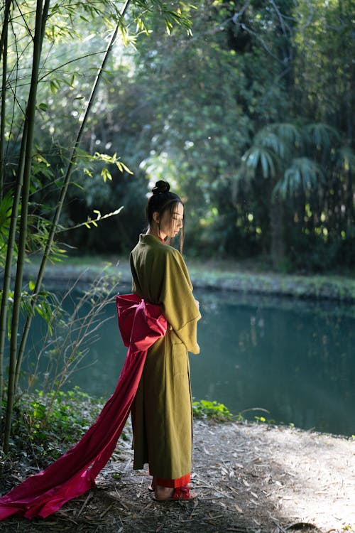 Free Woman in Green Kimono Standing Near A River Stock Photo