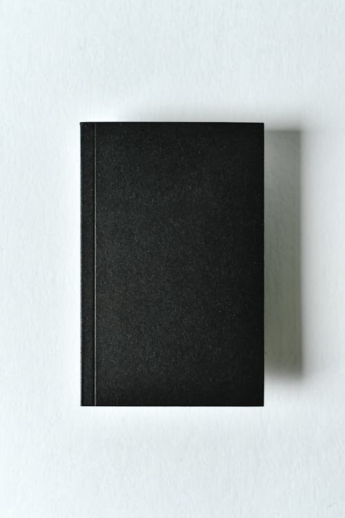 Free Black Journal on White Surface  Stock Photo